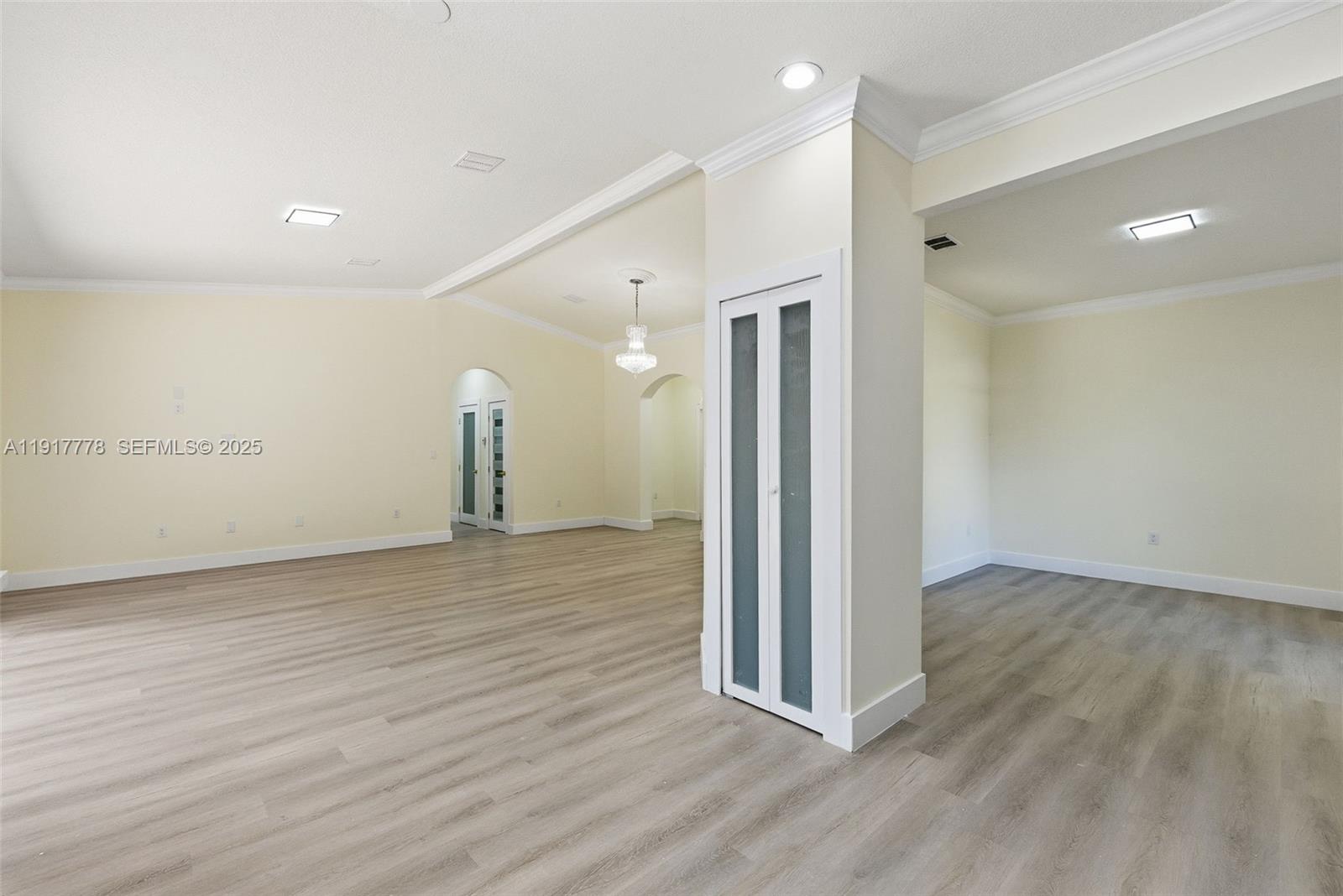 19601 Southwest 128th Court Miami, FL 33177 - Photo 9 of 59 a view of a room with wooden floor and window