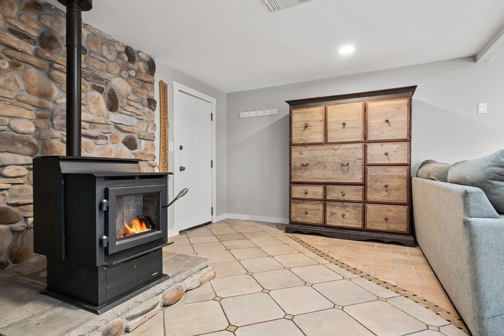 43 Colgate Road Beverly, MA 01915 - Photo 15 of 27 a bedroom with a bed and a fireplace