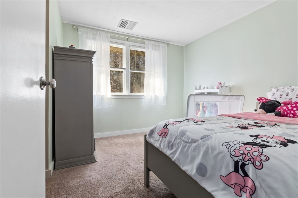 43 Colgate Road Beverly, MA 01915 - Photo 23 of 27 a bedroom with a bed and a window