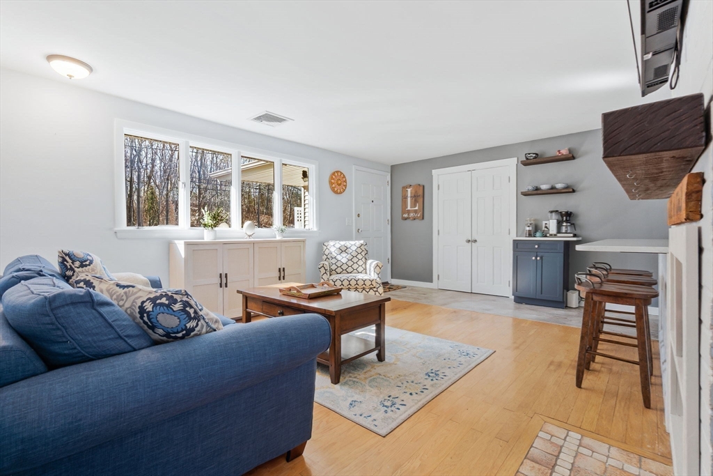 43 Colgate Road Beverly, MA 01915 - Photo 3 of 27 a living room with furniture a window and a table