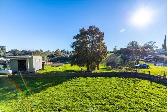 a view of an ocean a building in the background