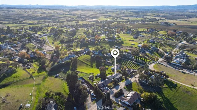 an aerial view of lake and residential houses with outdoor space