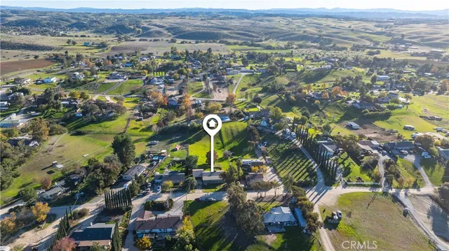 an aerial view of a residential houses with outdoor space