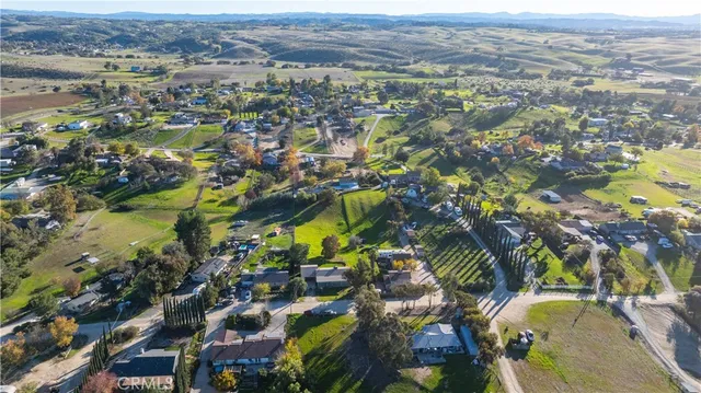 an aerial view of a golf course with a ocean view