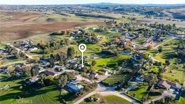 an aerial view of a houses with a lake view