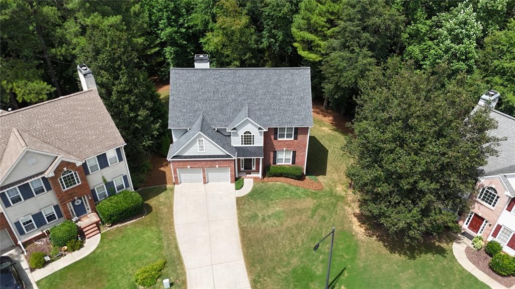 43 Ivy Mist Lane Acworth, GA 30101 - Photo 40 of 58 aerial view of a house with a yard and potted plants