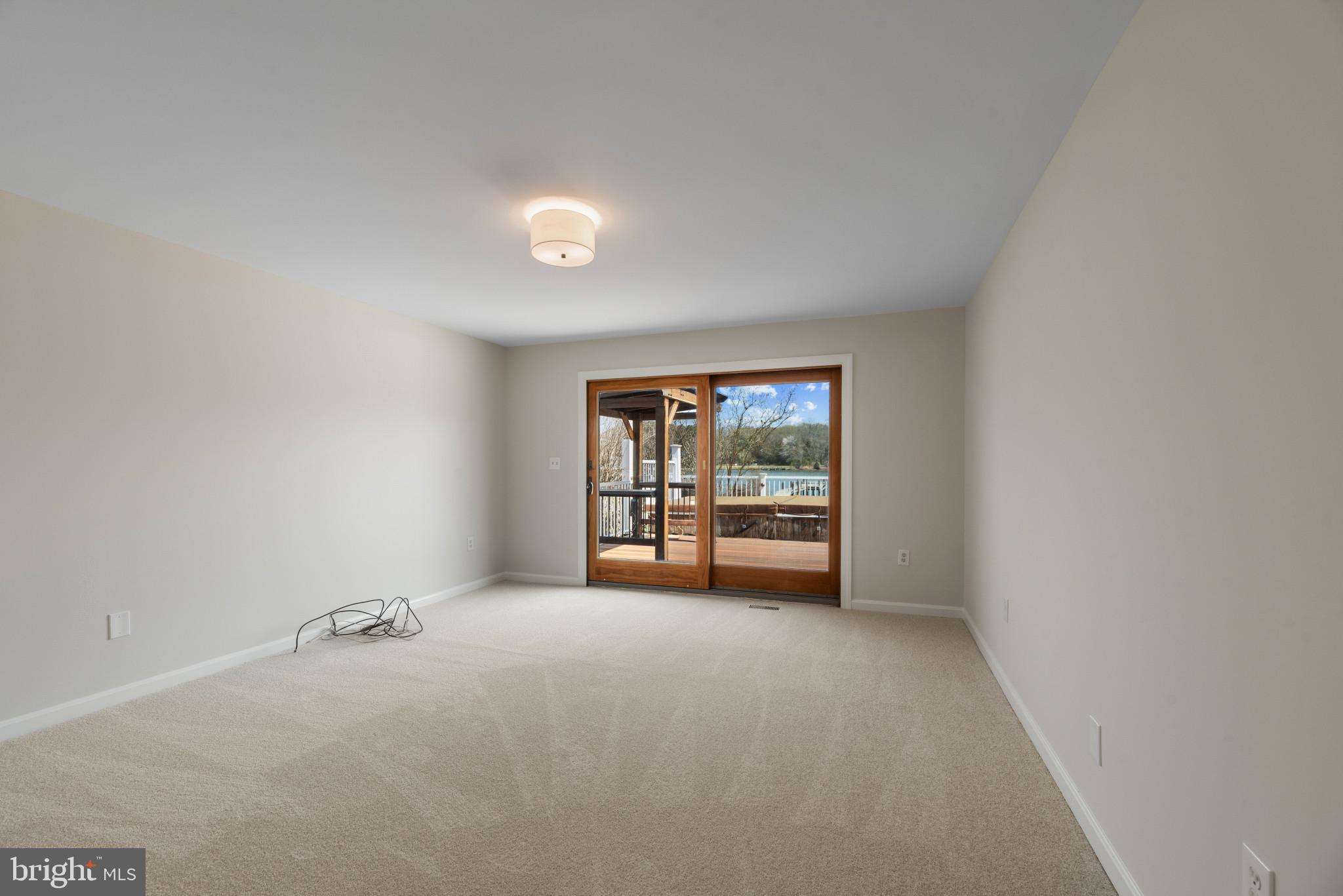 5929 Deale Beach Road Deale, MD 20751 - Photo 21 of 58 Spare room featuring light colored carpet and base