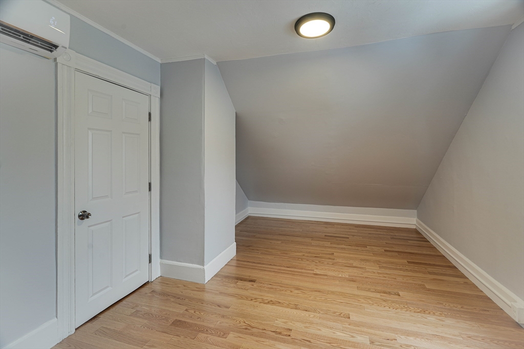 24 Dunlap Street Salem, MA 01970 - Photo 27 of 41 a view of an empty room with wooden floor and closet