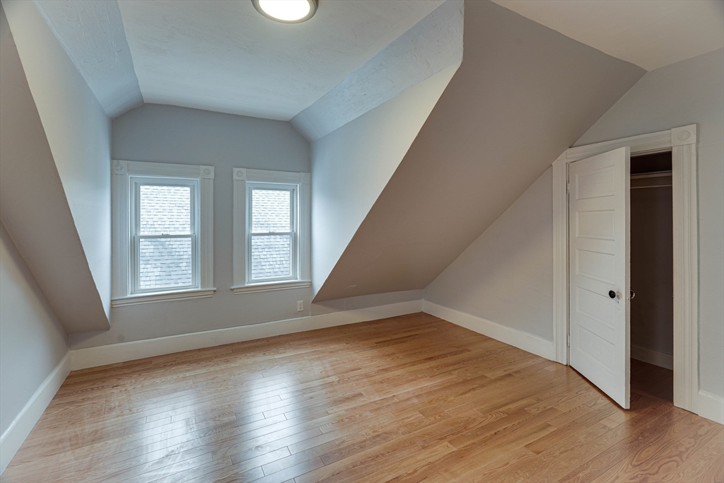 24 Dunlap Street Salem, MA 01970 - Photo 34 of 41 a view of an empty room with wooden floor and a window