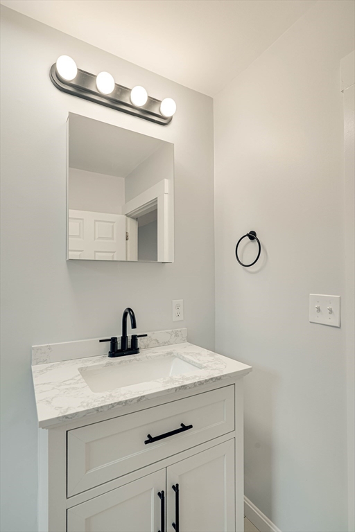 24 Dunlap Street Salem, MA 01970 - Photo 37 of 41 a bathroom with a sink and a mirror