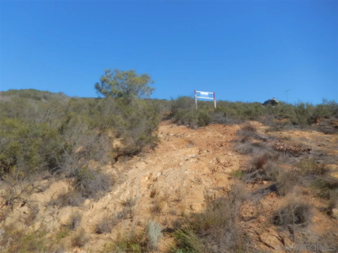 Mt Israel Road, Unit 90528788 Escondido, CA 92029 - Photo 7 of 18 a view of a dry yard with mountains in the background