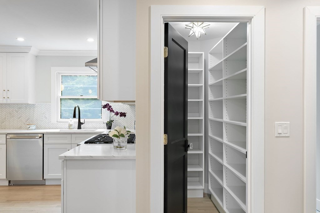 8 Longmeadow Road Weston, MA 02493 - Photo 16 of 39 a kitchen with a sink a cabinets and chairs