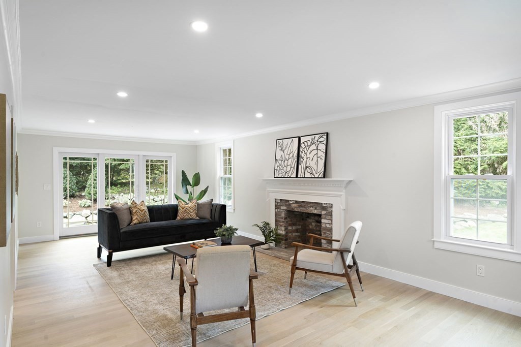 8 Longmeadow Road Weston, MA 02493 - Photo 17 of 39 a living room with furniture and a fireplace