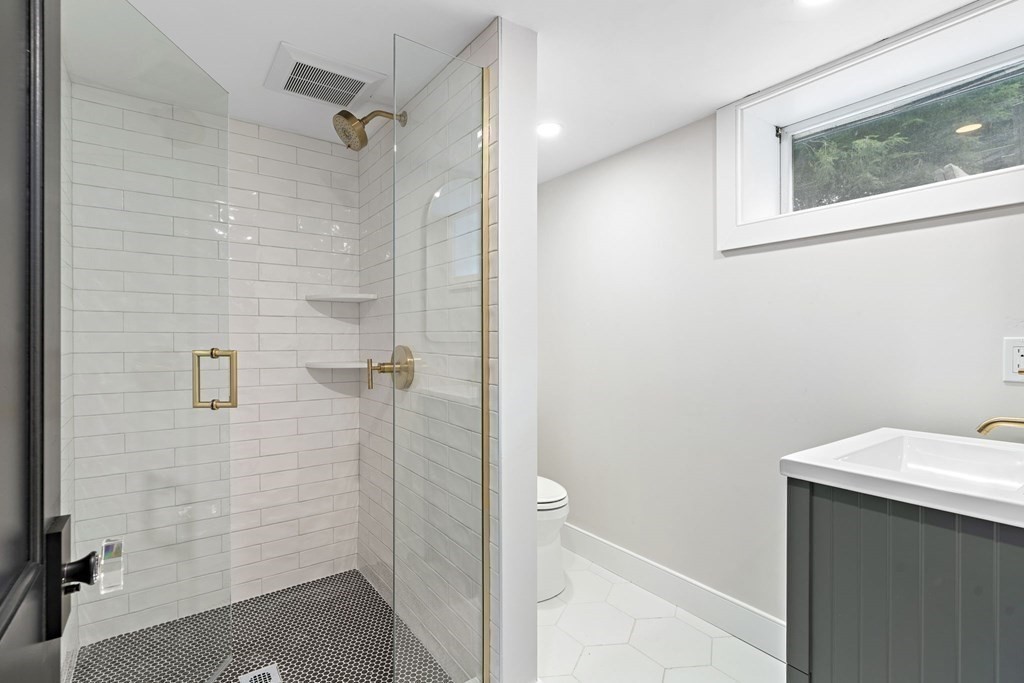 8 Longmeadow Road Weston, MA 02493 - Photo 34 of 39 a bathroom with a sink and shower