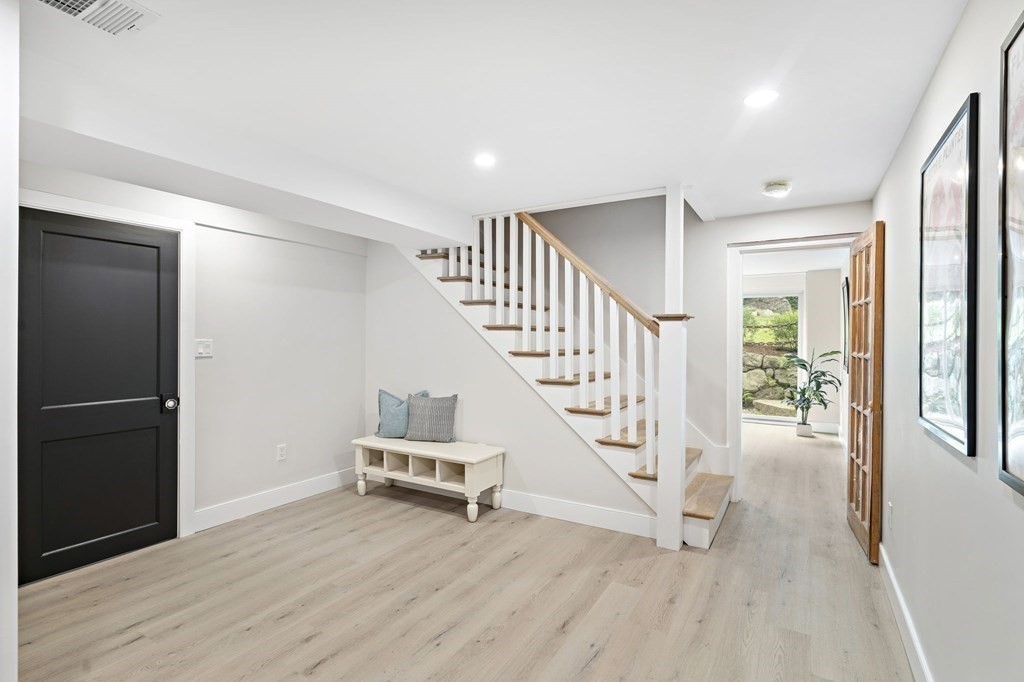 8 Longmeadow Road Weston, MA 02493 - Photo 35 of 39 a view of an entryway with wooden floor and staircase