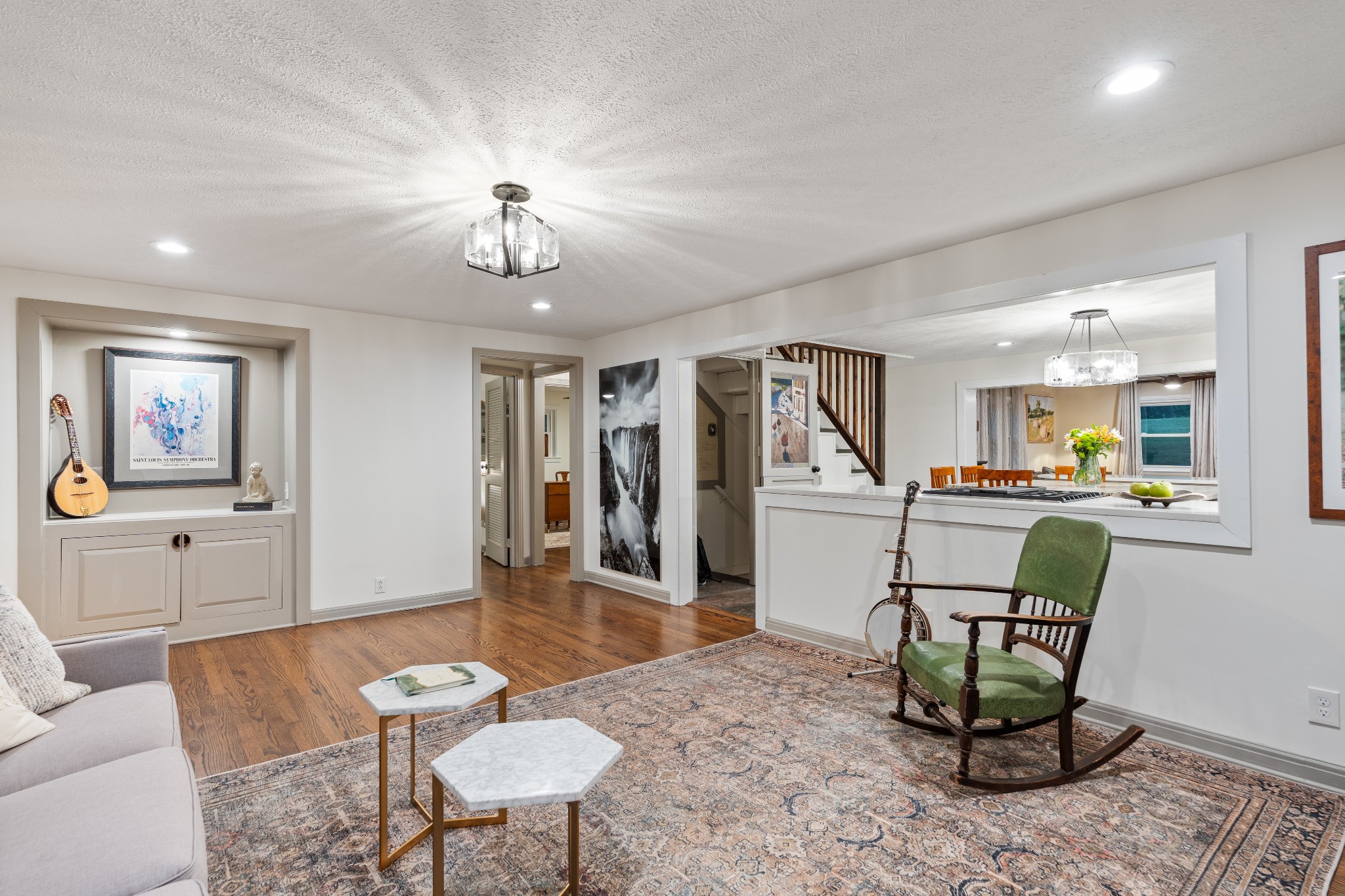 7770 Smith Road Primm Springs, TN 38476 - Photo 22 of 62 a living room with furniture a dining table and a refrigerator