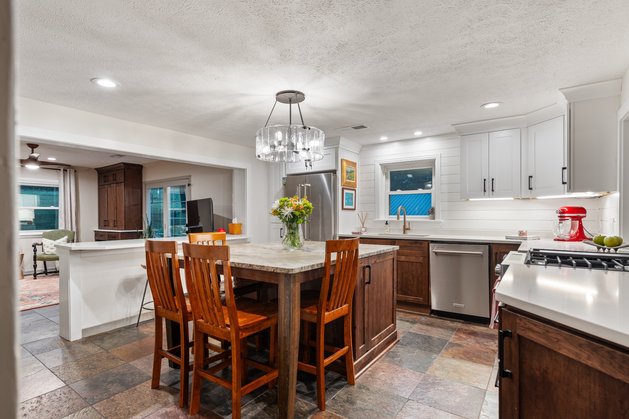 7770 Smith Road Primm Springs, TN 38476 - Photo 24 of 62 a kitchen with a dining table chairs and stove