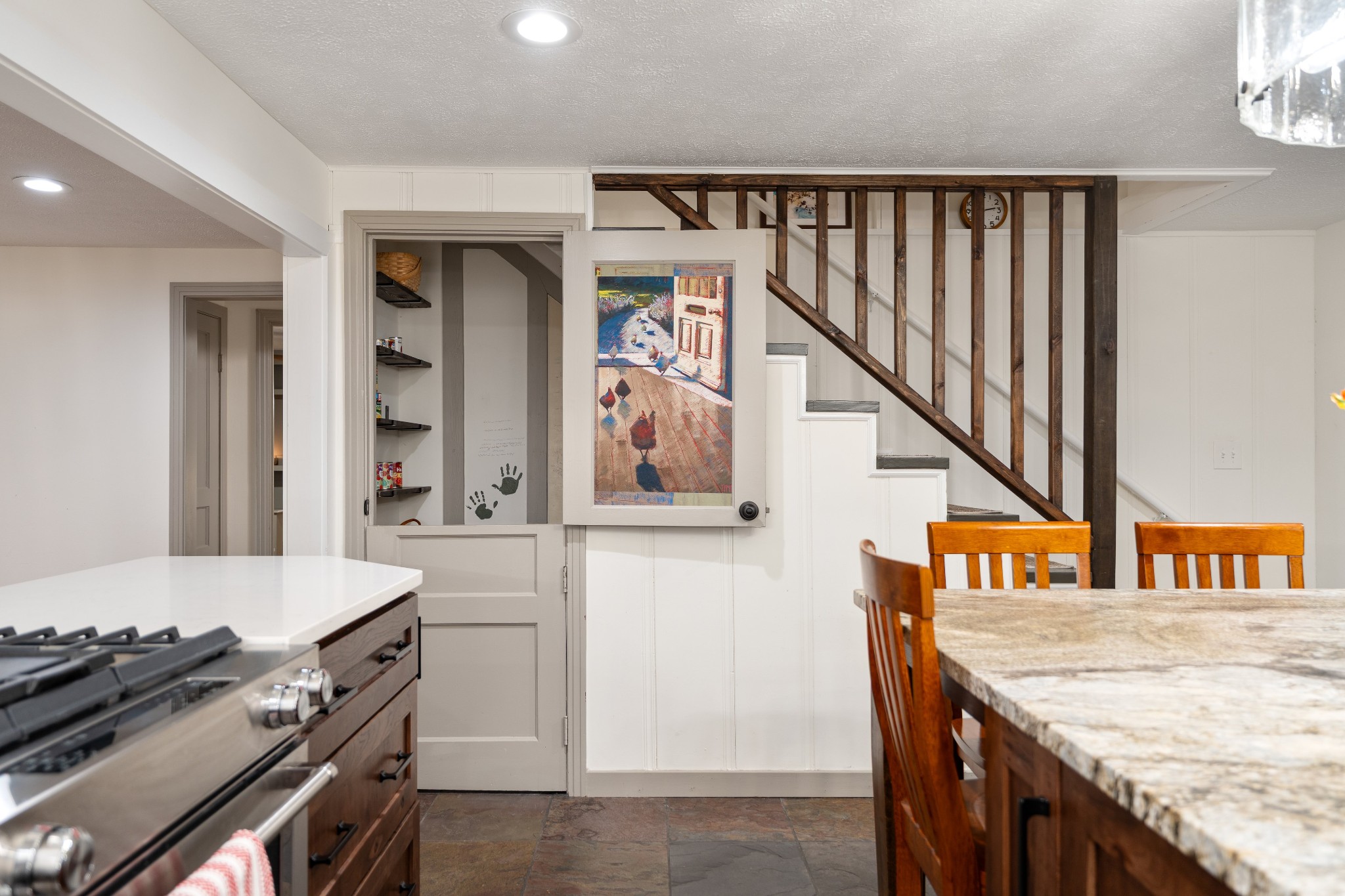 7770 Smith Road Primm Springs, TN 38476 - Photo 27 of 62 a kitchen with granite countertop a stove and a dining table