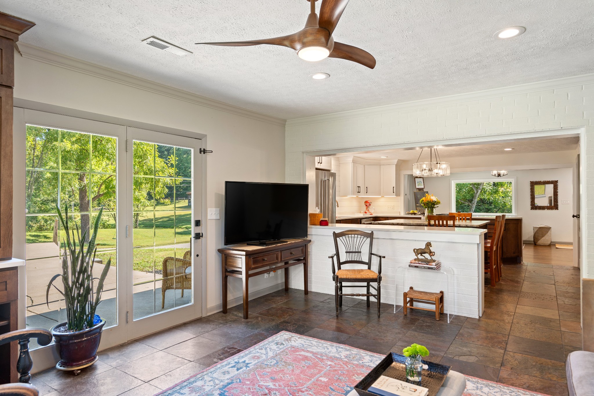 7770 Smith Road Primm Springs, TN 38476 - Photo 33 of 62 a living room with furniture a flat screen tv and a large window