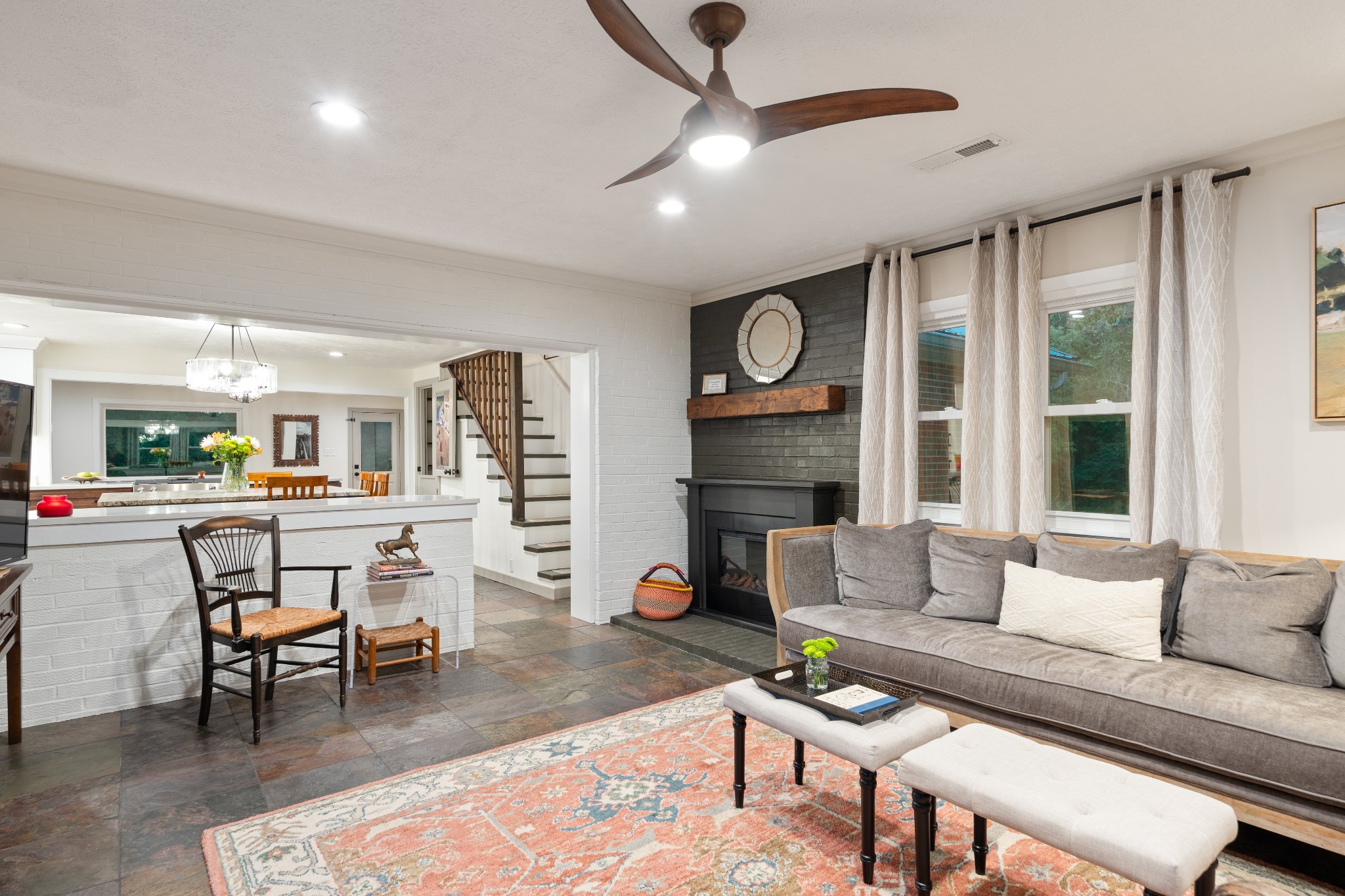 7770 Smith Road Primm Springs, TN 38476 - Photo 35 of 62 a living room with furniture a fireplace and a flat screen tv
