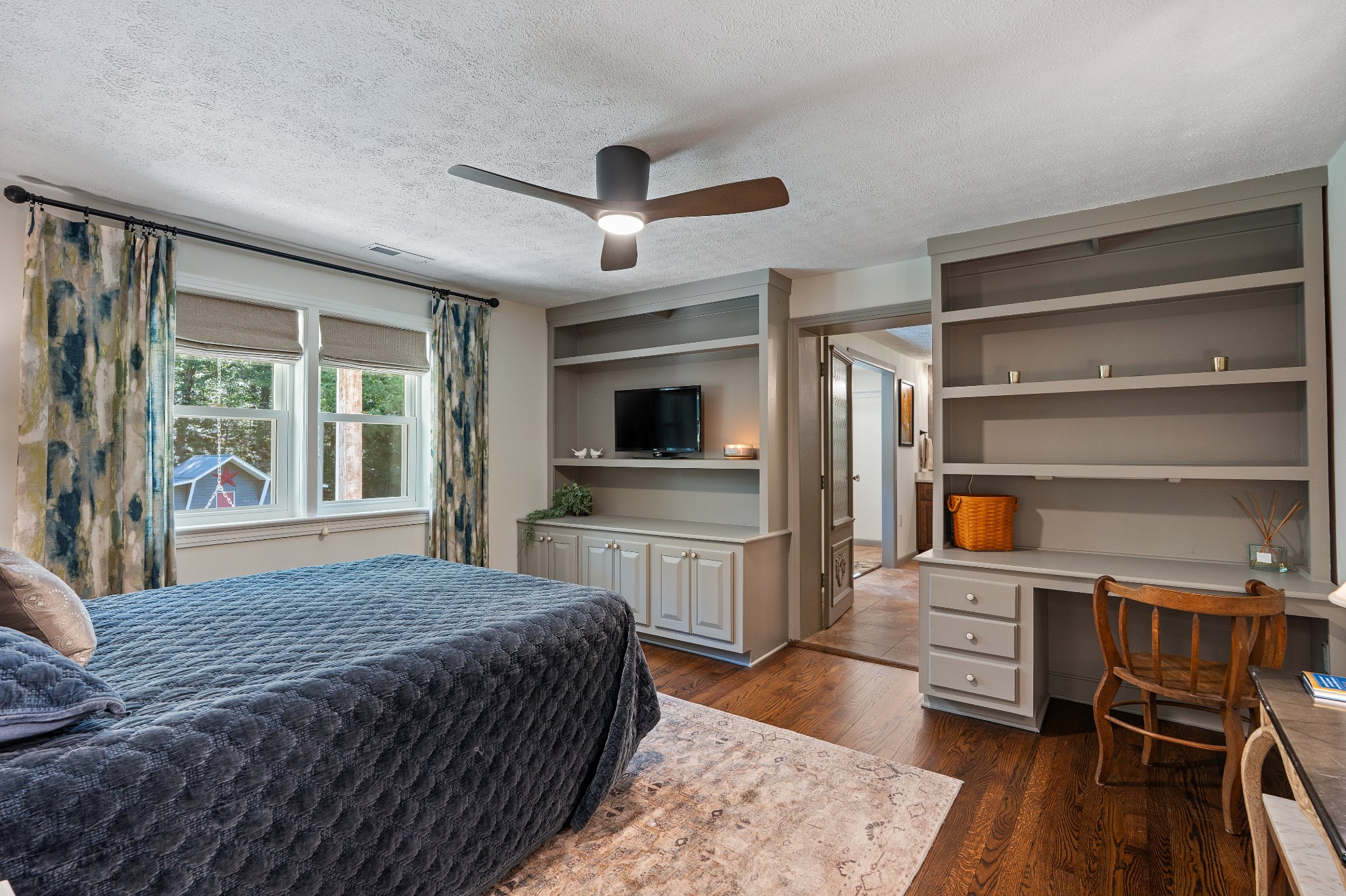 7770 Smith Road Primm Springs, TN 38476 - Photo 36 of 62 a bedroom with a bed and a flat screen tv