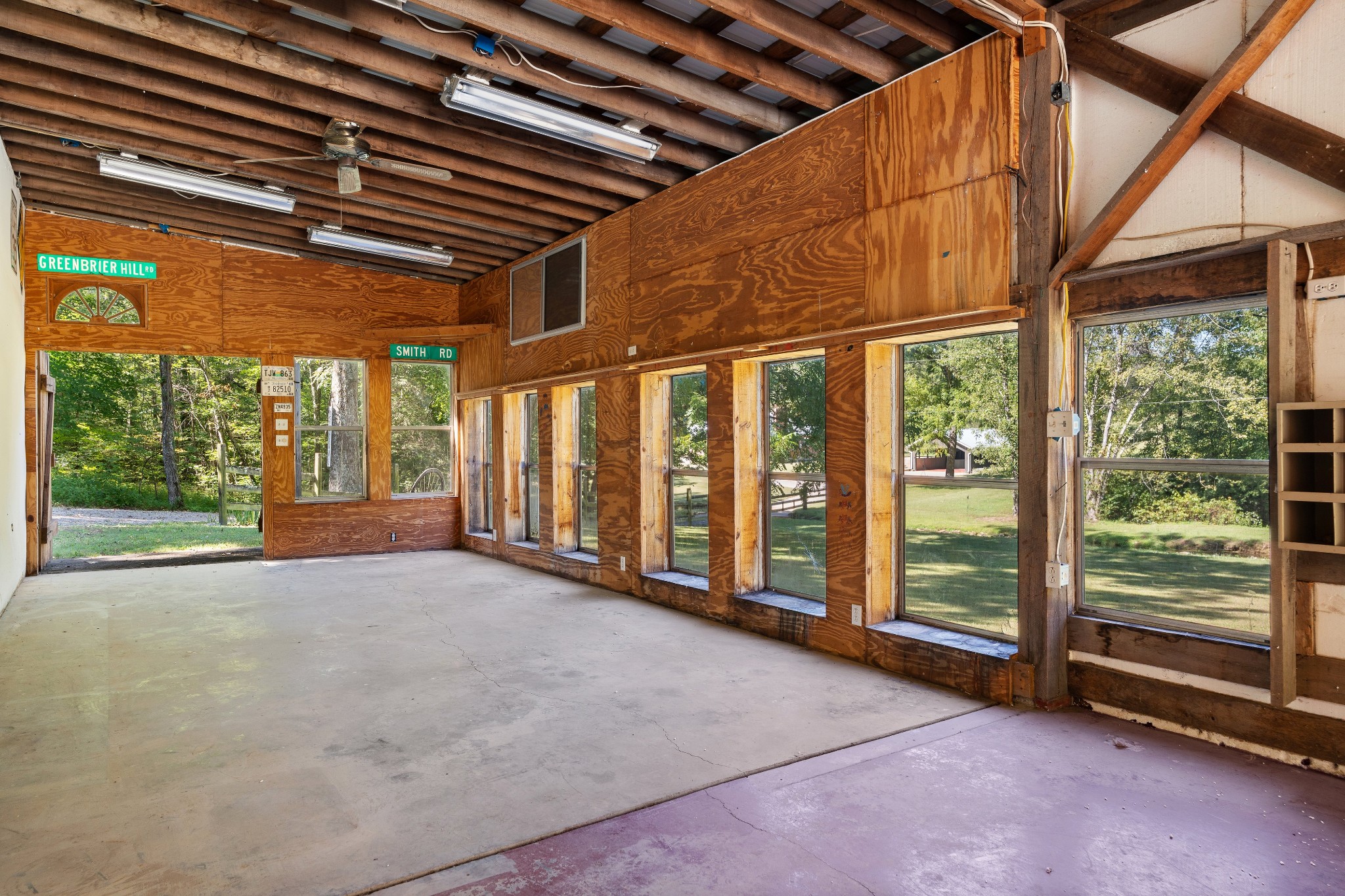 7770 Smith Road Primm Springs, TN 38476 - Photo 59 of 62 a view of an empty room with wooden floor and walls