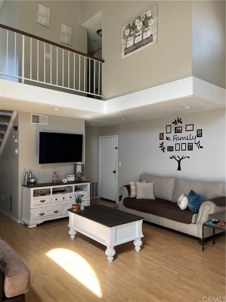 137 Elmtree Drive Perris, CA 92571 - Photo 1 of 21 a living room with furniture and a flat screen tv