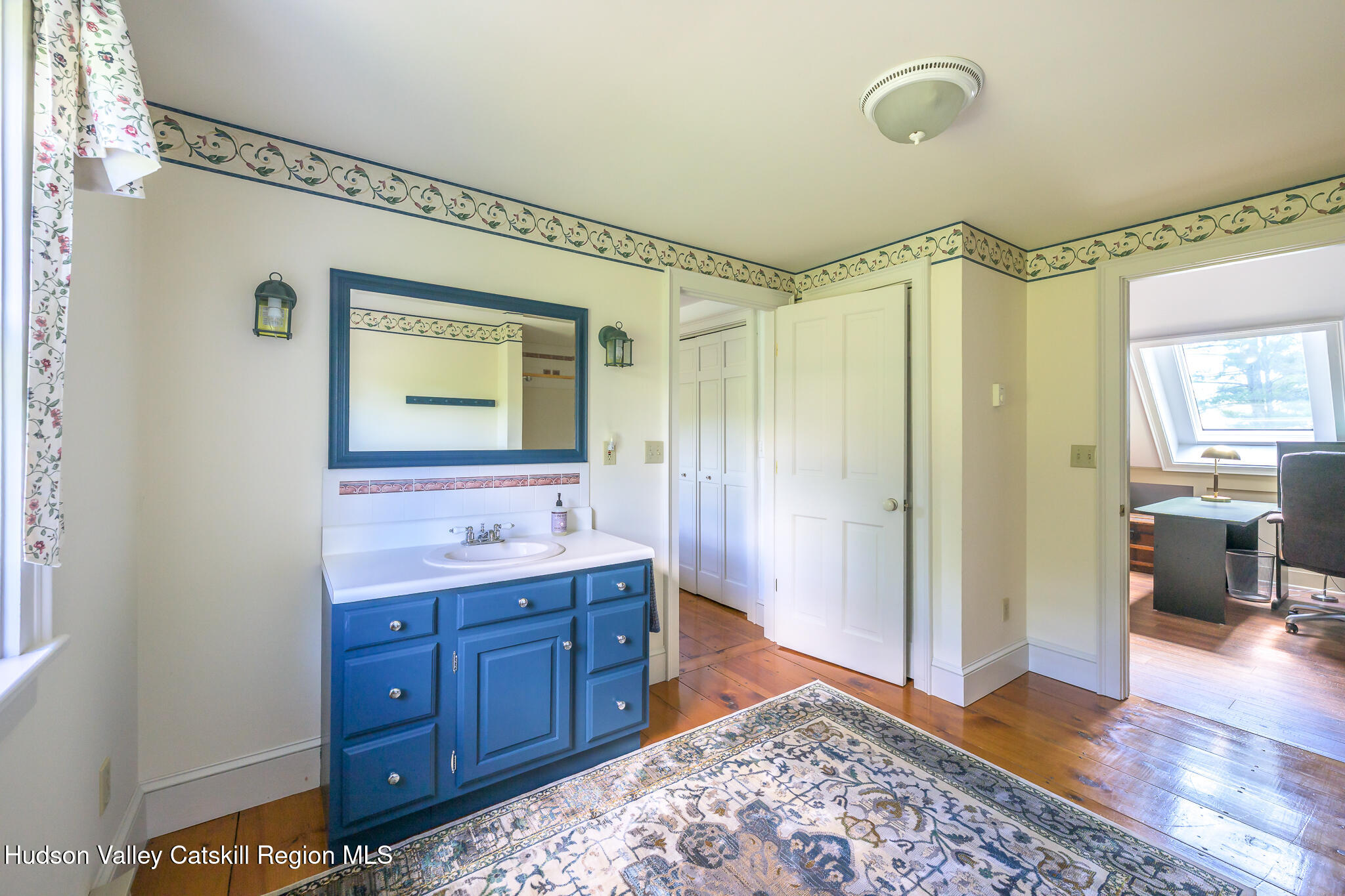 21 Stone House Road Canaan, NY 12029 - Photo 40 of 76 a bathroom with a granite countertop sink a mirror and a shower