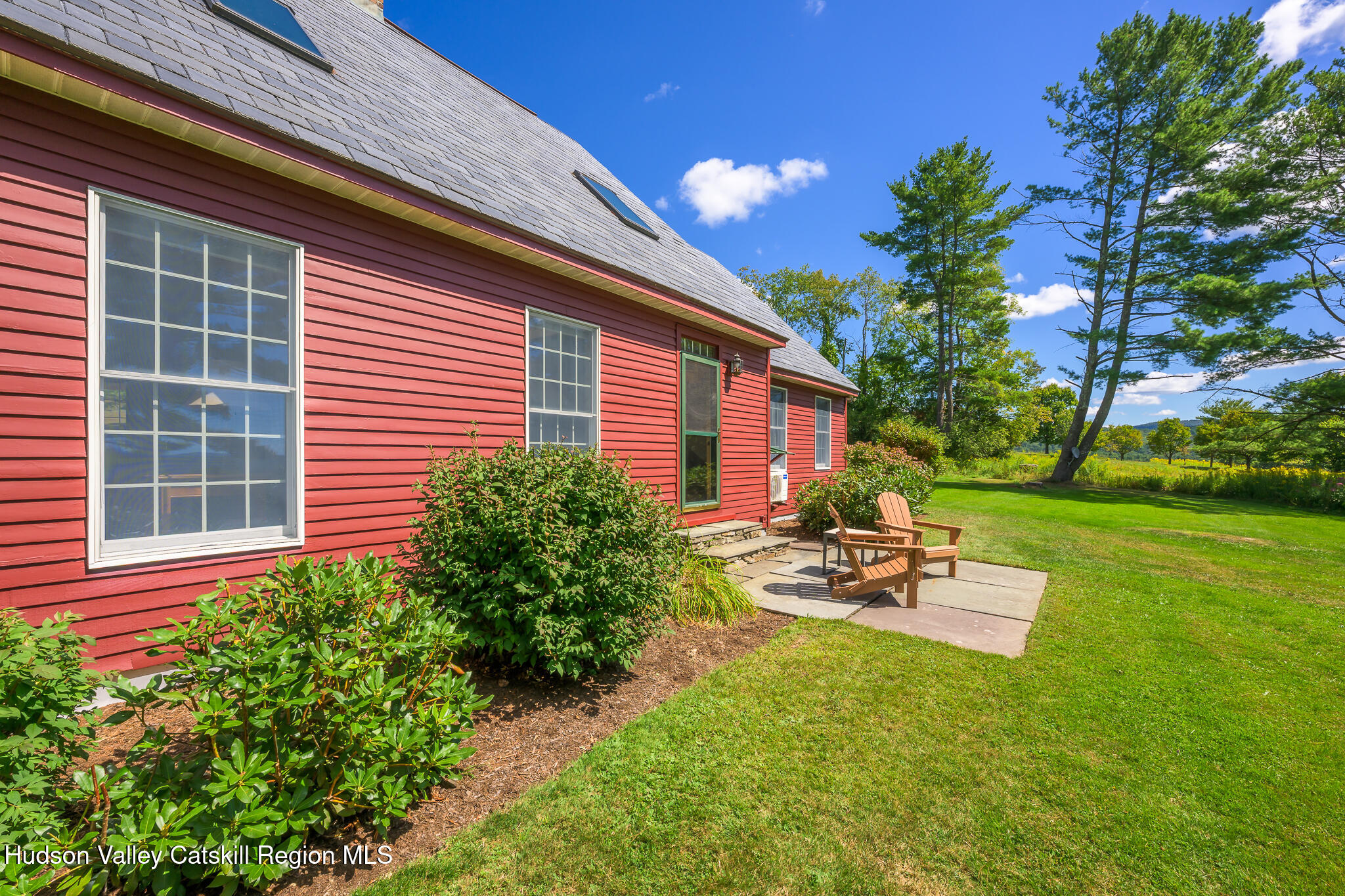 21 Stone House Road Canaan, NY 12029 - Photo 6 of 76 a view of a backyard with sitting area and garden