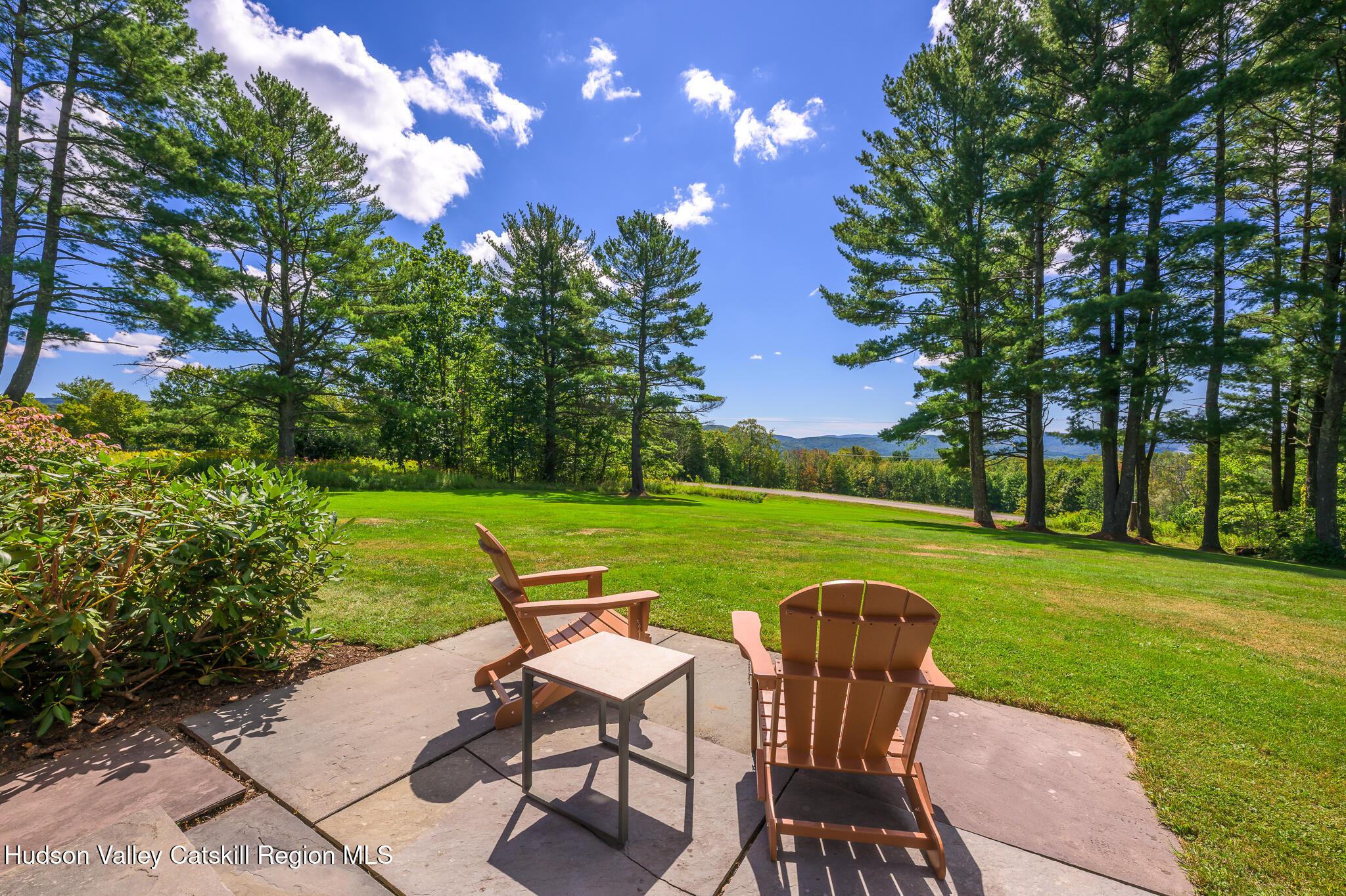 21 Stone House Road Canaan, NY 12029 - Photo 7 of 76 a view of a chair and table on the garden