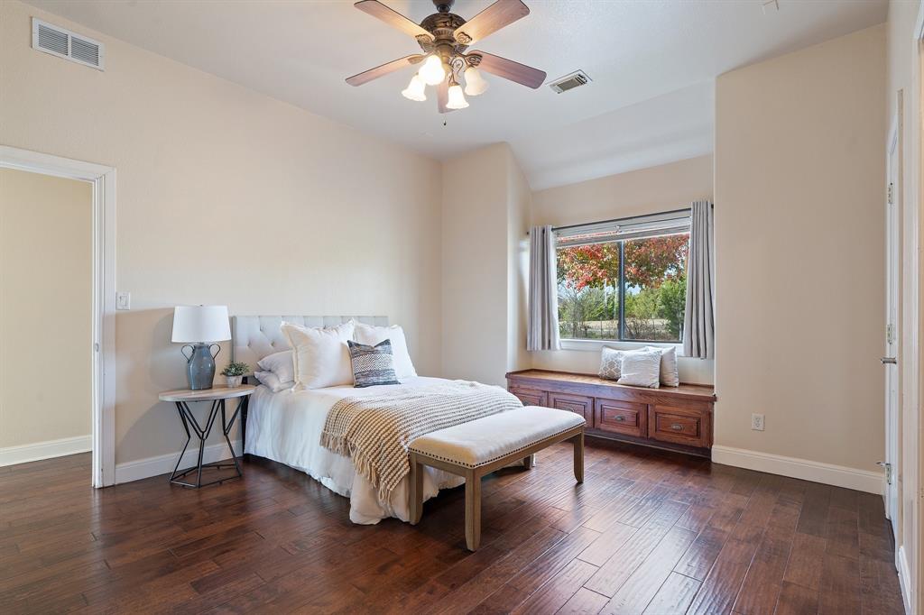 4421 Merritt Road Sachse, TX 75048 - Photo 12 of 38 a bedroom with a bed and a window