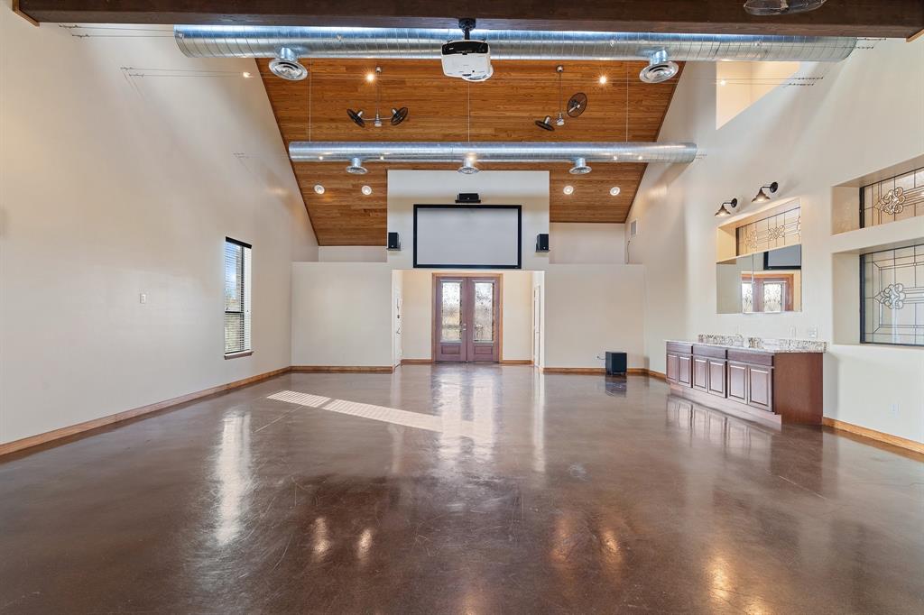 4421 Merritt Road Sachse, TX 75048 - Photo 20 of 38 a view of an empty room with window and wooden floor