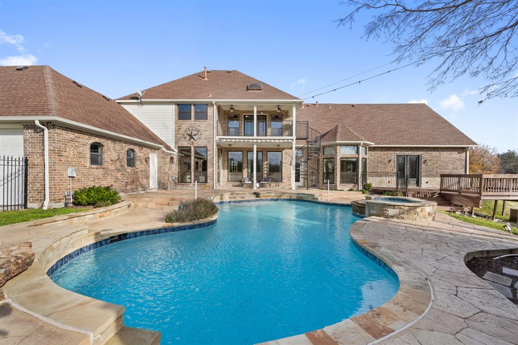 4421 Merritt Road Sachse, TX 75048 - Photo 28 of 38 a view of a house with pool fire pit and chairs in patio