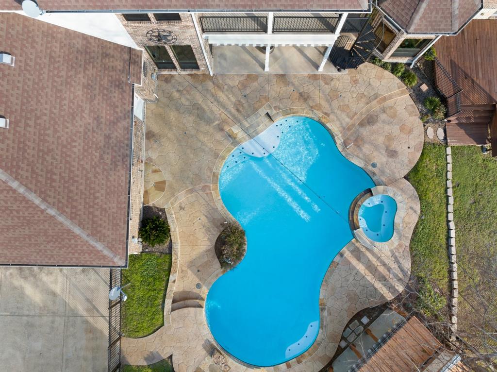 4421 Merritt Road Sachse, TX 75048 - Photo 33 of 38 an aerial view of a backyard with chairs and wooden floor