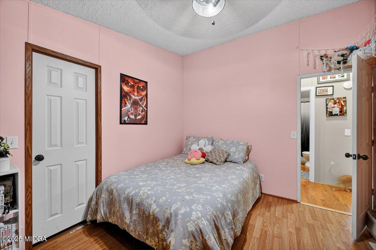 1659 Henderson Road Macon, GA 31217 - Photo 22 of 44 a bedroom with a bed and a view of bathroom