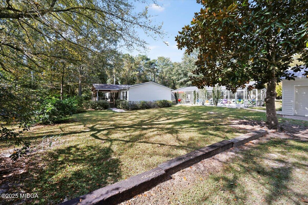 1659 Henderson Road Macon, GA 31217 - Photo 35 of 44 a view of a houses with yard and trees