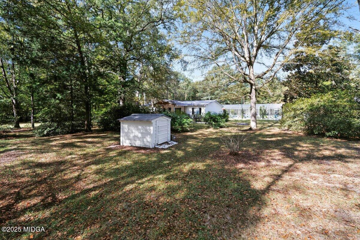 1659 Henderson Road Macon, GA 31217 - Photo 41 of 44 a backyard of a house with a tree