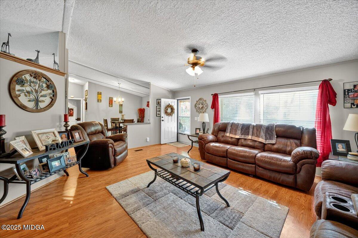 1659 Henderson Road Macon, GA 31217 - Photo 6 of 44 a living room with furniture a rug and a window