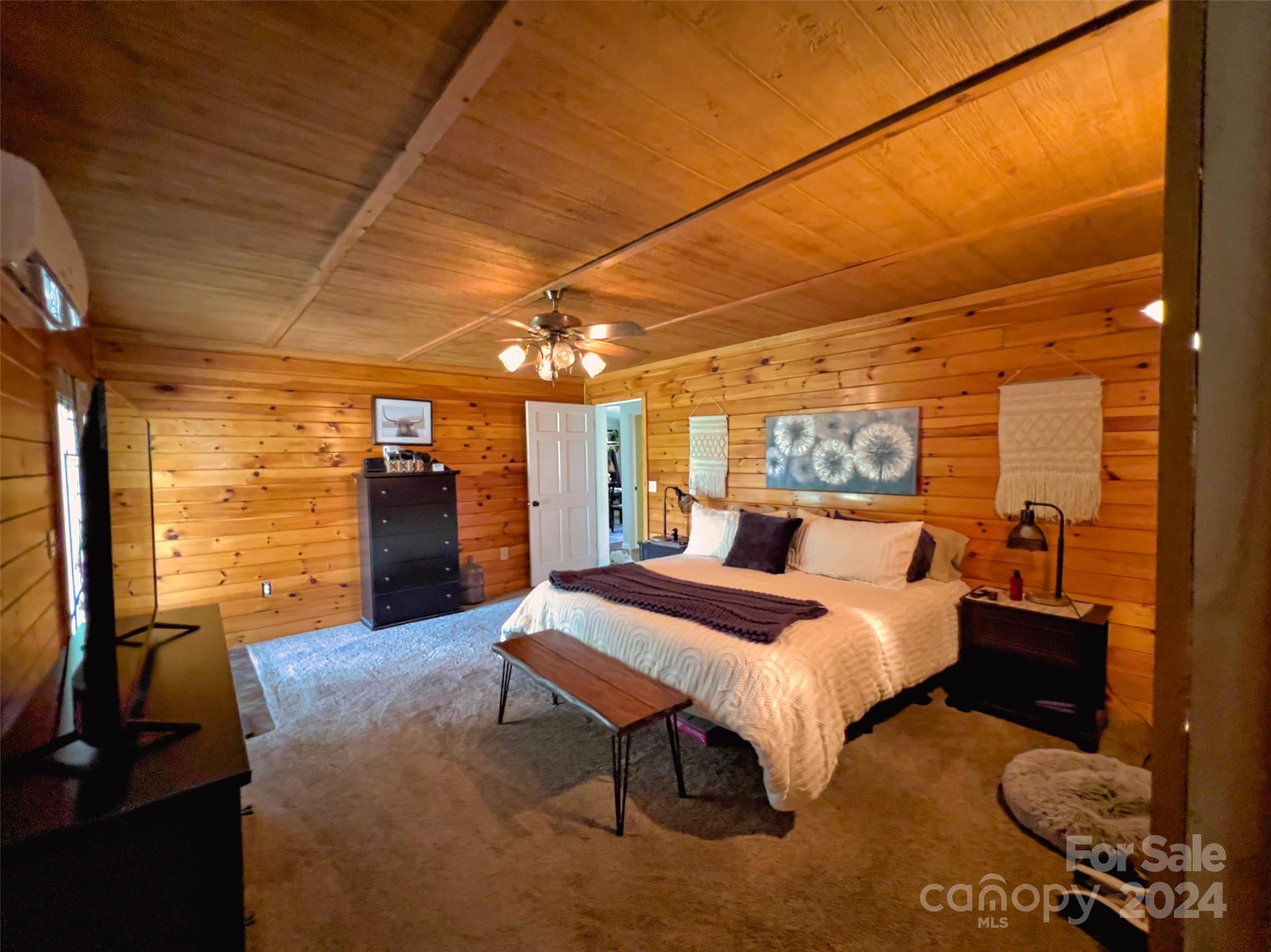 4264 Big Island Road Rutherfordton, NC 28139 - Photo 8 of 21 a bedroom with a bed and wooden floor
