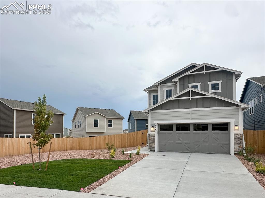 10847 Raylan Way Peyton, CO 80831 - Photo 1 of 40 a front view of a house with a yard