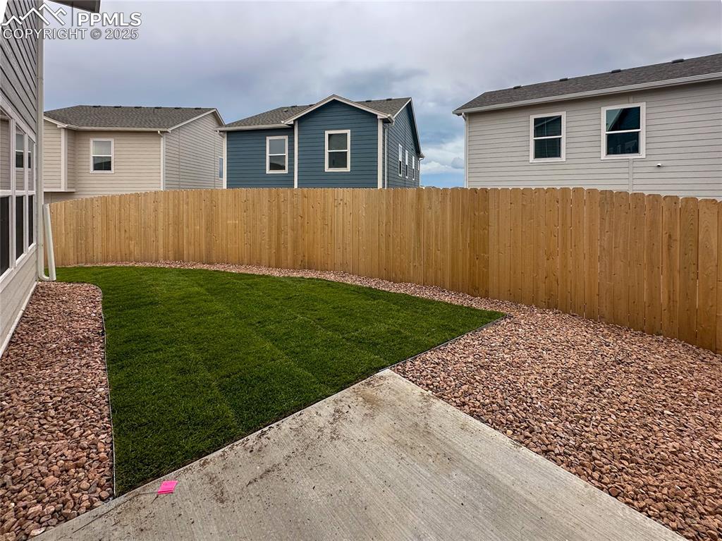 10847 Raylan Way Peyton, CO 80831 - Photo 13 of 40 a view of a backyard with wooden fence