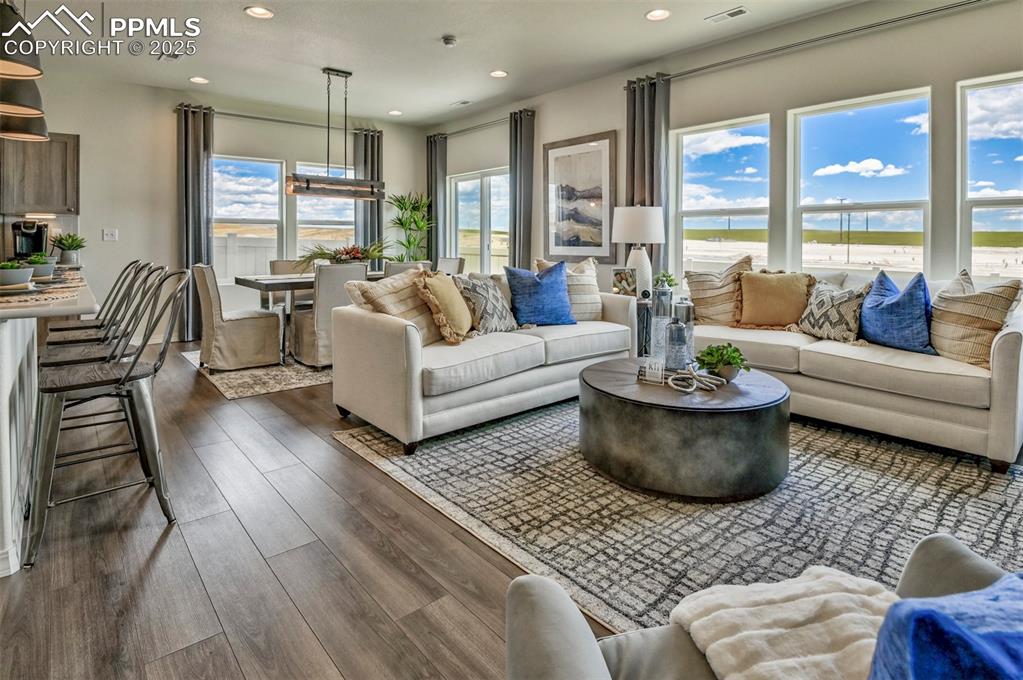 10847 Raylan Way Peyton, CO 80831 - Photo 18 of 40 a living room with furniture and a large window