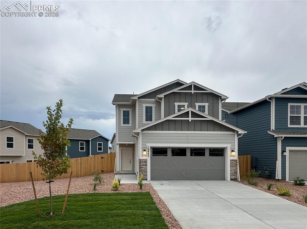 10847 Raylan Way Peyton, CO 80831 - Photo 2 of 40 a front view of a house with a yard