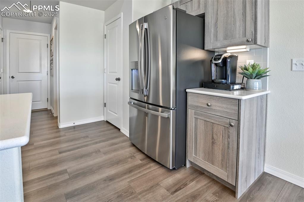10847 Raylan Way Peyton, CO 80831 - Photo 23 of 40 a kitchen with stainless steel appliances a refrigerator and cabinets