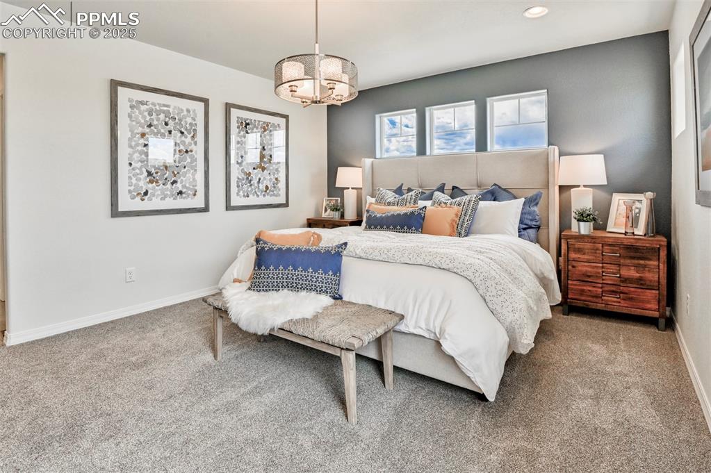 10847 Raylan Way Peyton, CO 80831 - Photo 27 of 40 a bedroom with bed and window