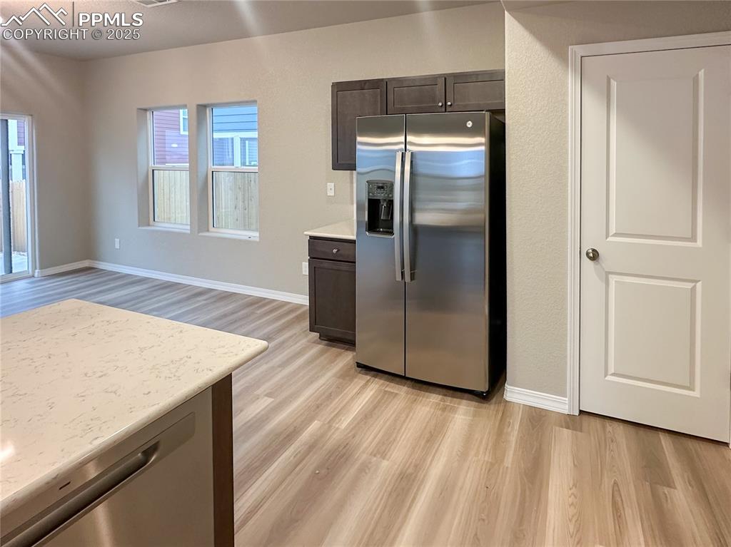 10847 Raylan Way Peyton, CO 80831 - Photo 6 of 40 a kitchen with stainless steel appliances granite countertop a refrigerator and a sink