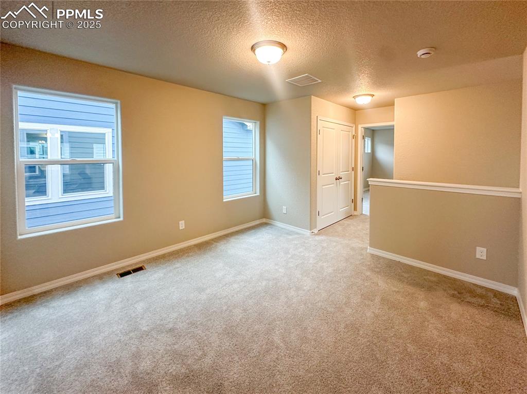 10847 Raylan Way Peyton, CO 80831 - Photo 7 of 40 a view of an empty room with a window