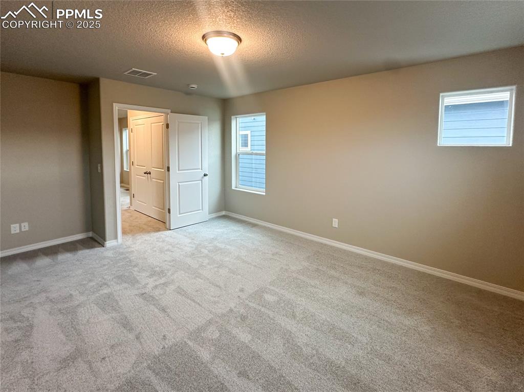 10847 Raylan Way Peyton, CO 80831 - Photo 8 of 40 a view of an empty room and a window
