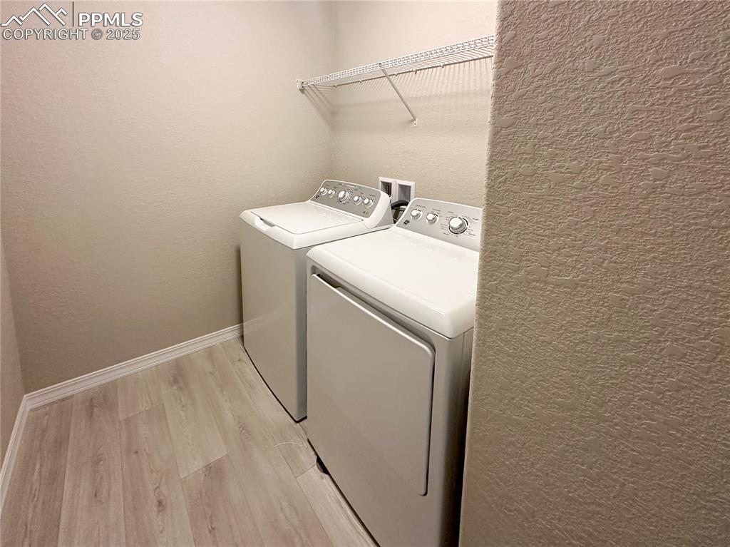 10847 Raylan Way Peyton, CO 80831 - Photo 10 of 40 a utility room with dryer and washer