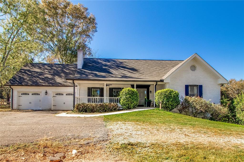 3925 Mark Lake Road Cumming, GA 30028 - Photo 1 of 59 a view of a house with backyard and garden